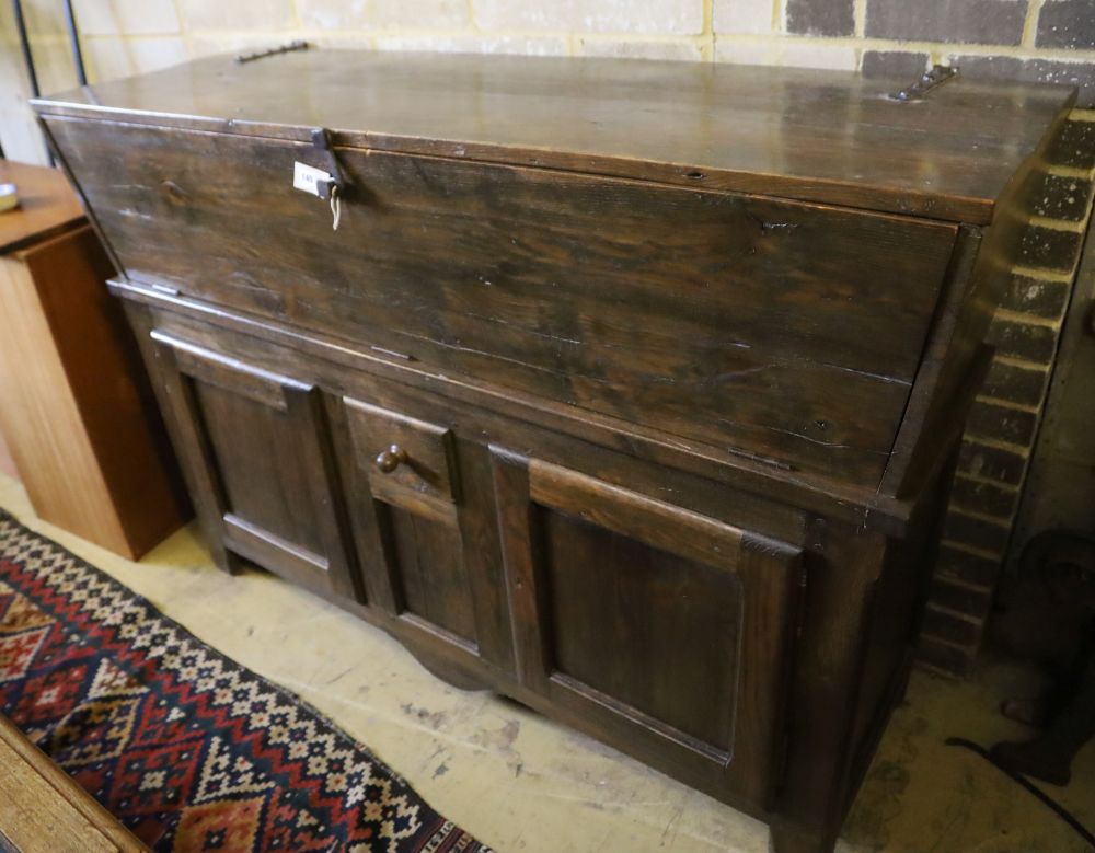 A French elm dough bin on cabinet base fitted two doors and a small central drawer, width 162cm, depth 51cm, height 112cm